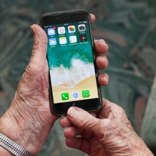 Senior holding an smartphone