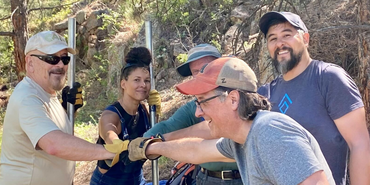 Jon, Limina's co-founder, Limina staff and other volunteers rebuilding hiking trails near Lyons